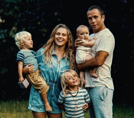 Teresa Palmer and Mark Webber pictured with their kids Bodhi Rain (son in Teresa's arms), Forest Sage, and Poet Lake Palmer (daughter in Mark's hand).