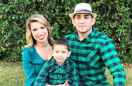 Cristina with her husband and their son.