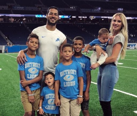 Brandie and Logan pictures with their five sons Cameron, Blake, Carter, Logan Jr, and Heavy Devy.