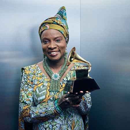 Angelique Kidjo holding her 2020 Grammy Award