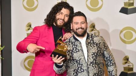 Dan + Shay holding their 2020 Grammy Award