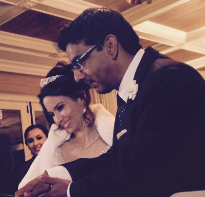 Dinesh D'Souza cutting the cake with his wife Deborah Fancher at their wedding