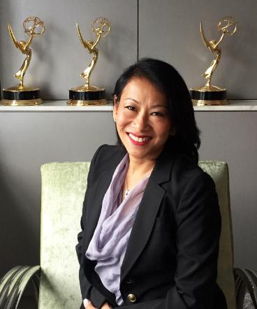 Melissa Lonner At Her Office in front of her achievements in the form of Awards