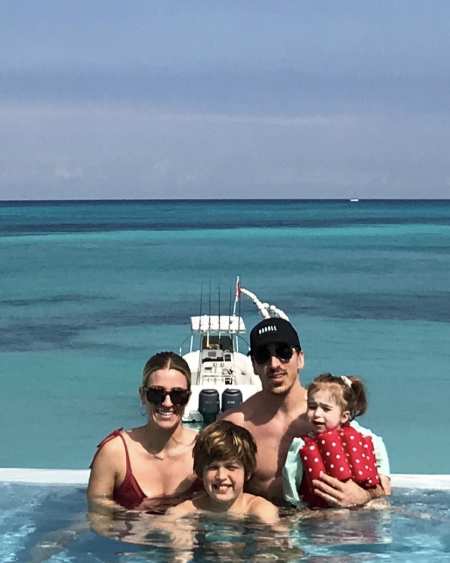Katrina Sloane and Brad Marchand with their children on vacation. Explore more about Katrina & Brad's adventurous marital life.
