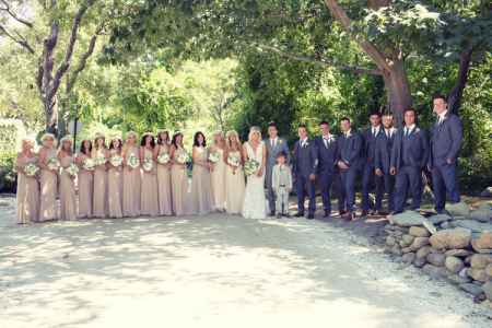 The bridegroom, Katrina Sloane and Brad Marchand with their bridesmaids and groomsmen. Want to know more about the couple's wedding details?