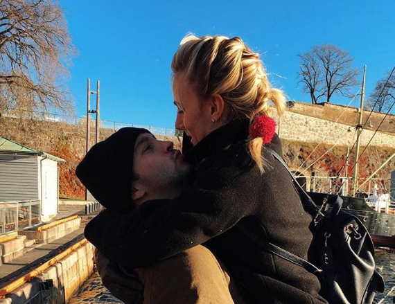 Tyler Joseph Wife Jenna Joseph  hugging  and kissing each other