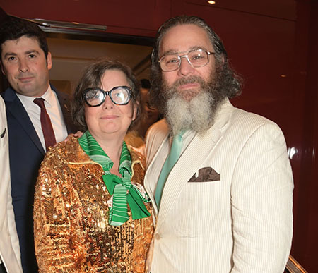 Andy accompanies his pin-stripe white suit with teal tie