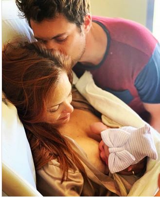 Drew Kissing His Amy At The Time Of Their Child Born Day