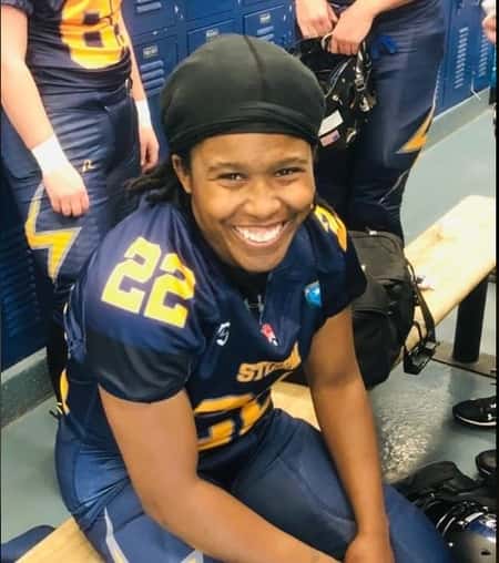 Jasmine Plummer in her Football playing outfit in the lockerroom