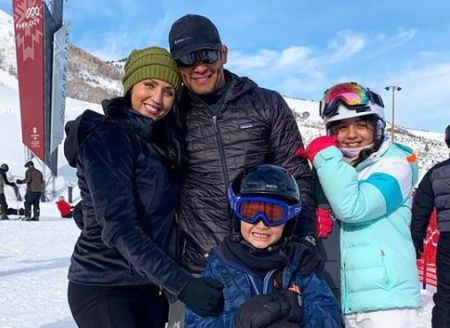 Kristen and her husband Mark with their kids.