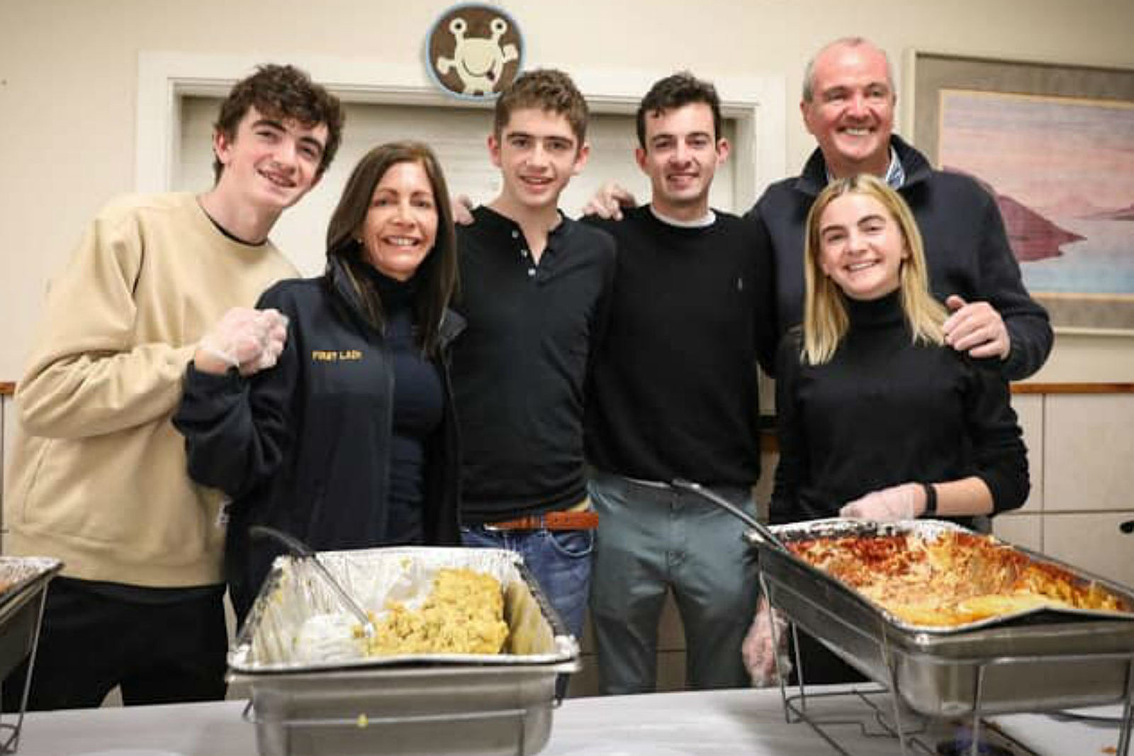 Tammy with her husband and four children, enjoying a happy life.