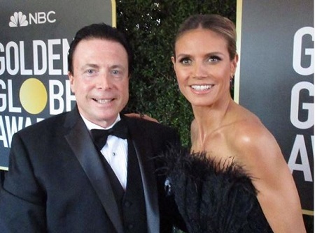 The business anchor Frank Mottek poses with German/American model, businesswoman Heidi Klum.