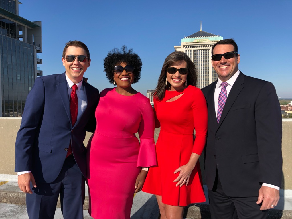 Bethany Davis with her co-anchors.