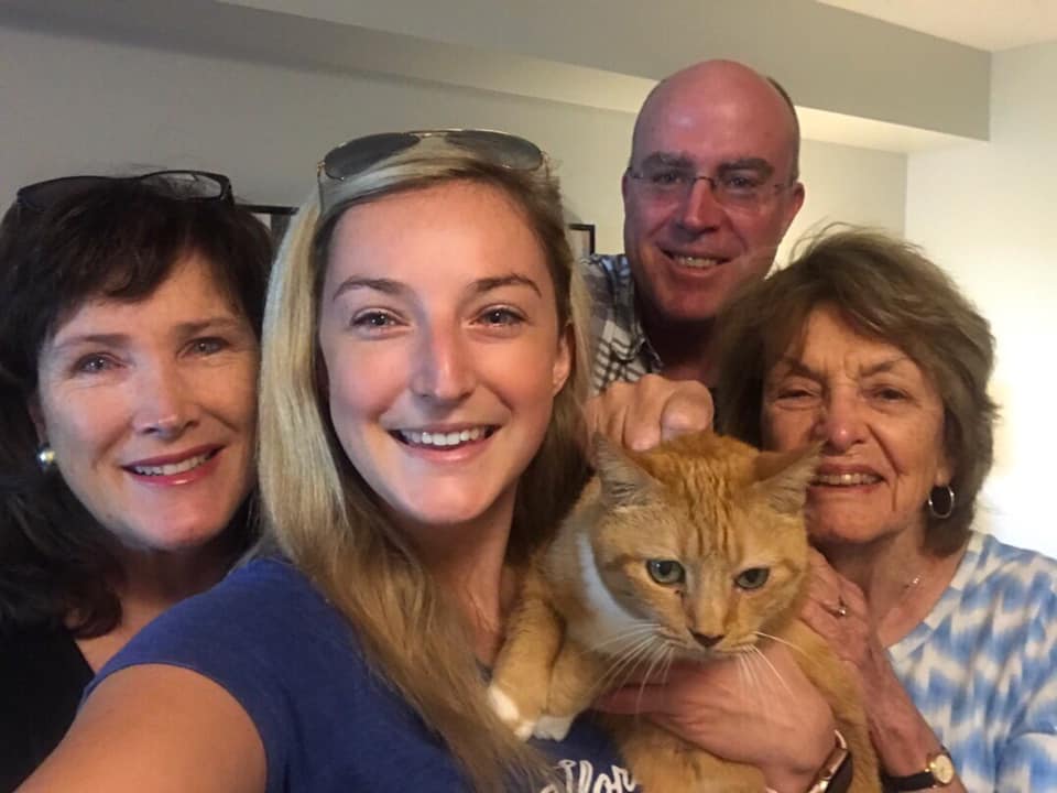 Lee with her parents and grandmother.
