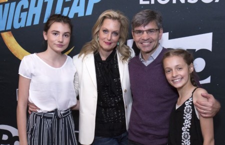 George and his wife with their daughters.