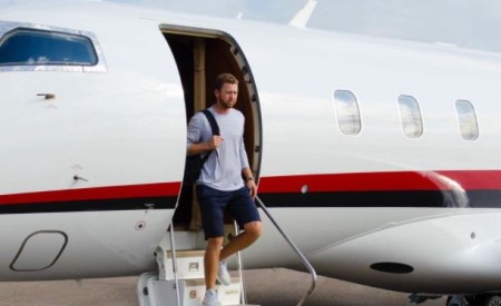 Berger's travel arrangement made by Nicholas Air.