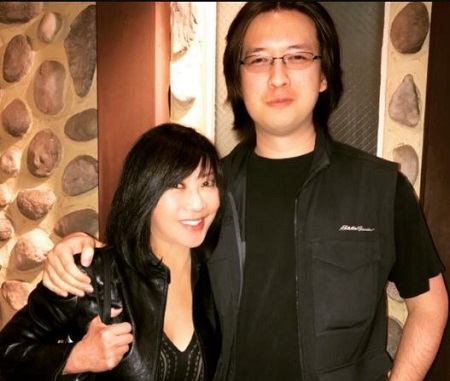 The Chinese born American journalist Kaity Tong shared a son named Philip Long with her first husband, Robert 'Bob' Long.