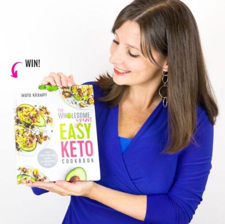 Maya Krampf holding her Cookbook and anouncing its giveaway.