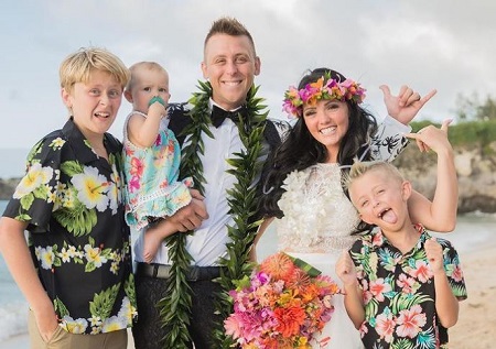 Noah Vaughn (left) with his father Roman, step-mom Brittney, and half-siblings Alexander (right), Cora Atwood.