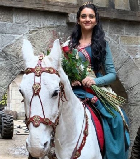 Geraldine Viswanatha as Eliza and Alexandra Shitshoveler in Miracle Workers