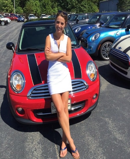 She is in white dress.