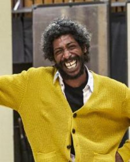 Johann Myers wearing smile on his face.