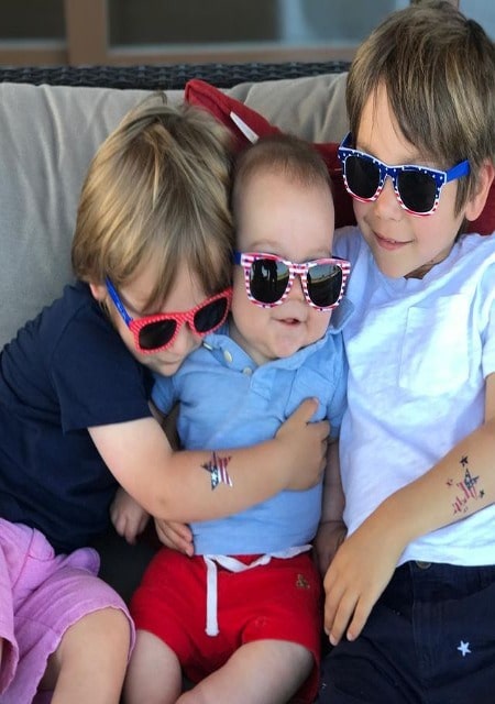 They are sitting in a couch.