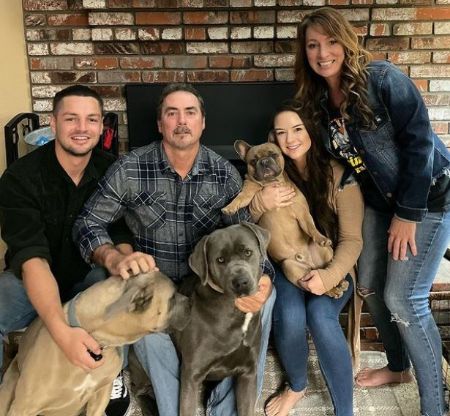 Chayce with his mom, dad, sibling and three pet dogs.