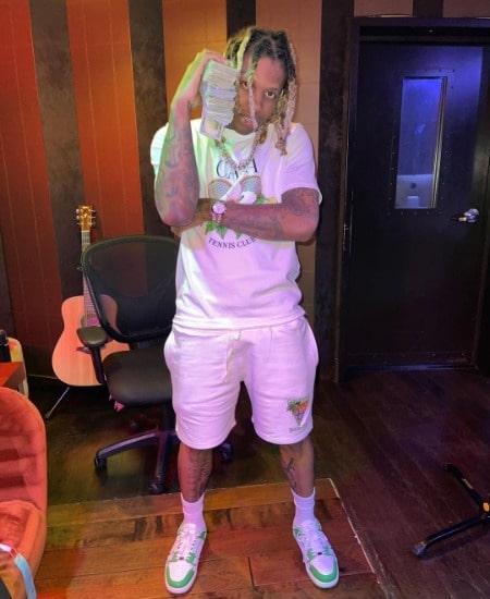 He is in white dress.