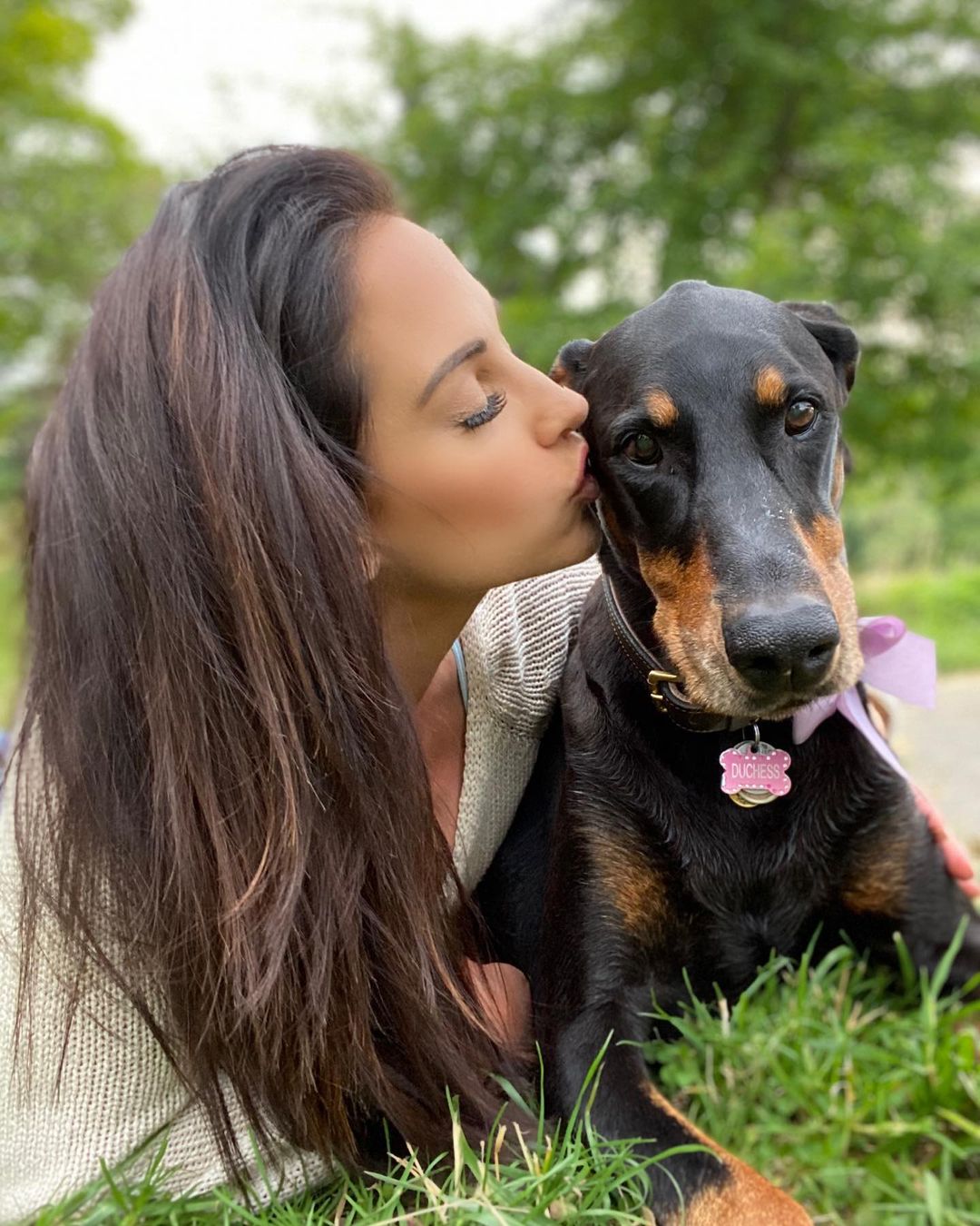 Emily Compagno, Peter's wife, with their pet dog.