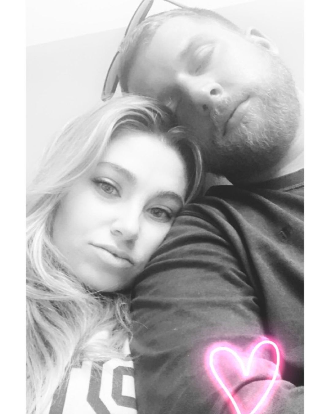 Mrs. and Mr. Chrisley showing love.