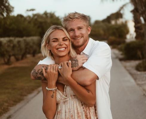 Blair Hanks with his fiancee-turned-wife Isabella Hanks.