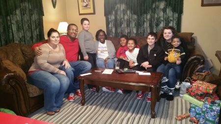 Dustin Bryant's mom, Dusty Dawn McCall and stepdad, Charles J. McCall sitting on the couch along with his stepsiblings. How old is Dustin as of now?