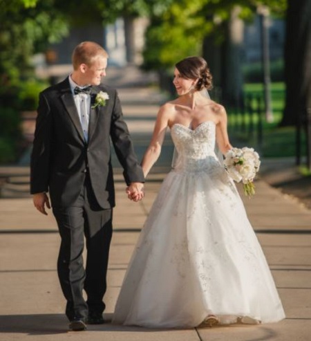Snap: Emily Spain and Travis Ross pose on their wedding dress.Source: Facebook @Emily Spain - KOMU 8 News