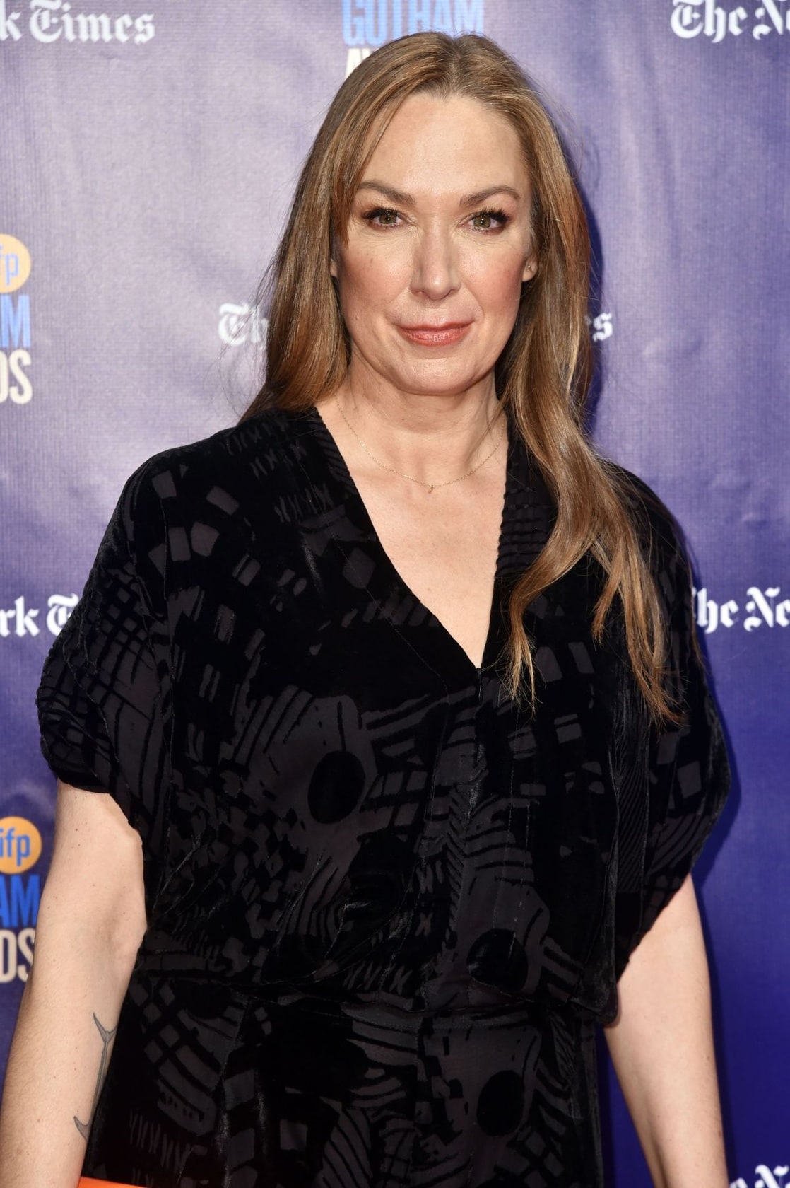 Elizabeth Marvel in her long hair wearing black tops