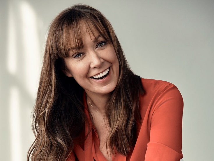 Elizabeth Marvel in her long hair wearing a red shirt