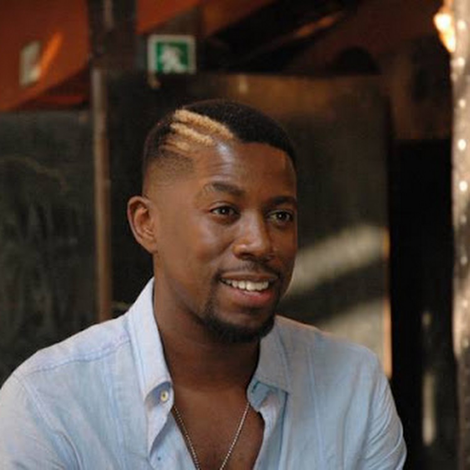Photo of Atandwa Kani wearing a blue shirt. 