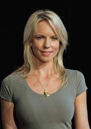 Jessica Napier in brown t shirt and a silver hair