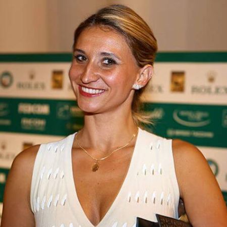 Photo of Ilham Vuilloud wearing a white dress.