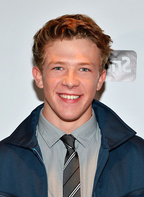 Kevin Csolak wearing dark bule jacket and grey shirt