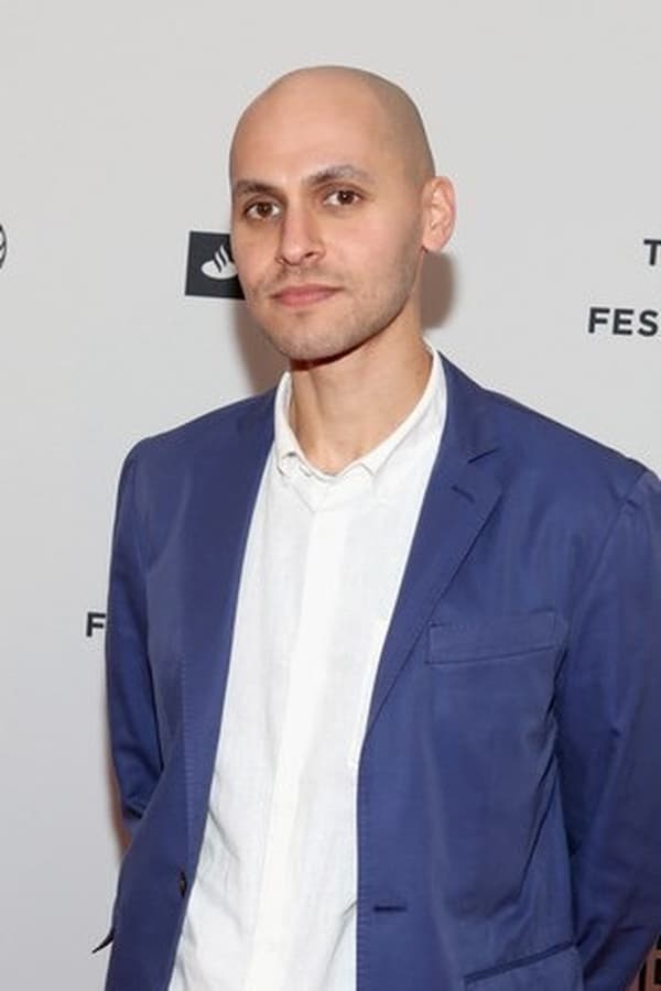 Jody Lee Lipes wearing white shirt and dark blue coat