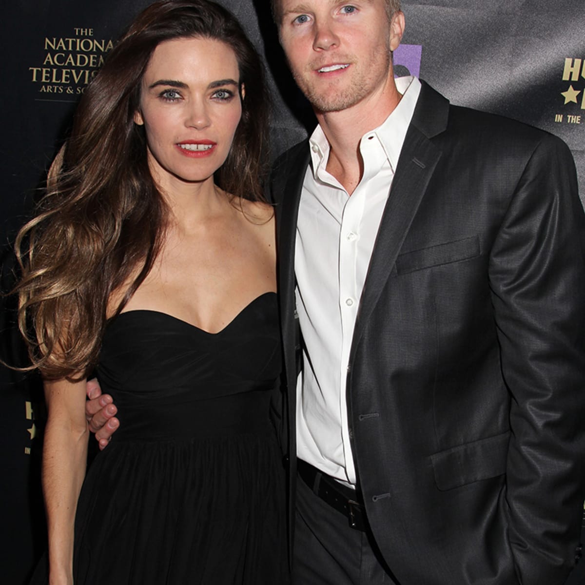 Amelia Heinley and her husband Thaddeus Rowe Luckinbill  posing for a photoshoot