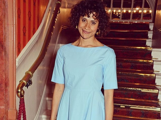 Photo of Angle Coulby wearing blue dress at occasion.