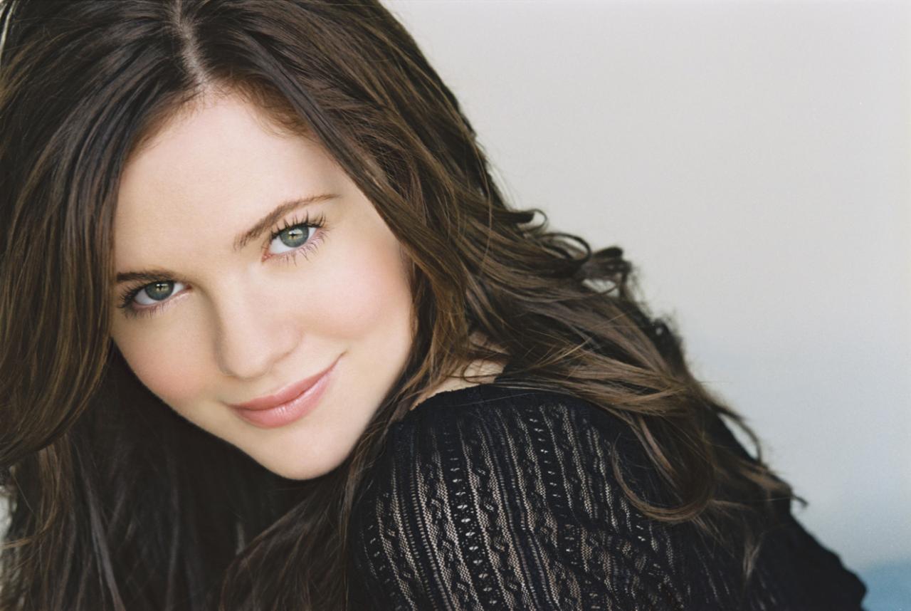 Caitlin Custer in a black tops.