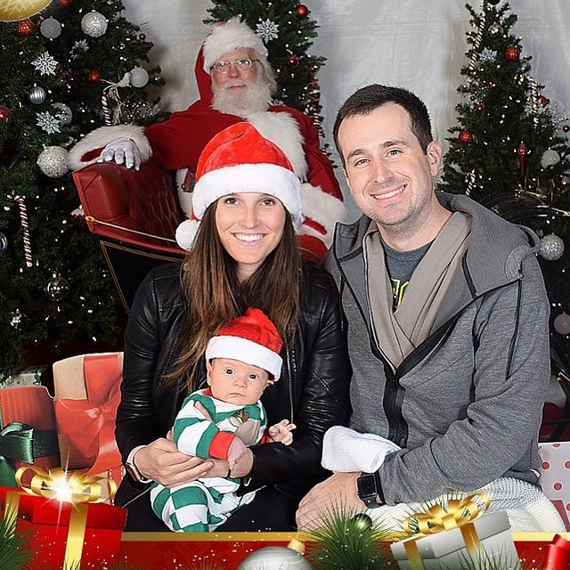 Brooke Hoover posing with her husband by wearing black leather jacket.