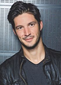 Photo of Eric Bruneau  wearing a leather jacket and a black t-shirt.