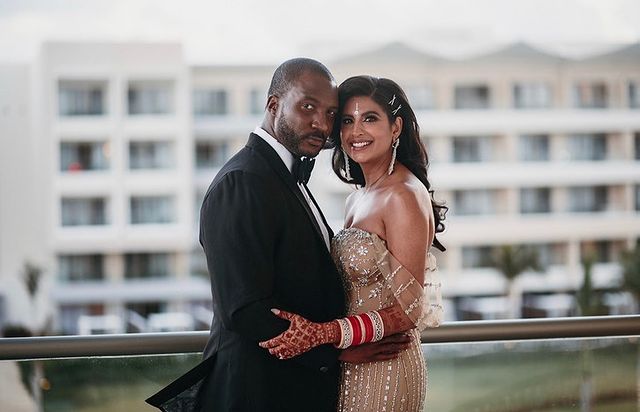 Eme Ikwuakor posing posing by wearing black suit. 