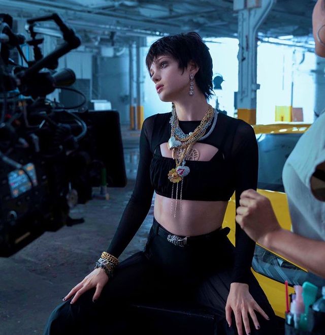 Elena wearing black dress.