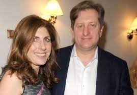 Steve was wearing a white color shirt and blue coat.