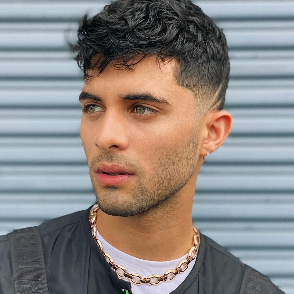 Erick Brian Colon posing for a photoshoot.